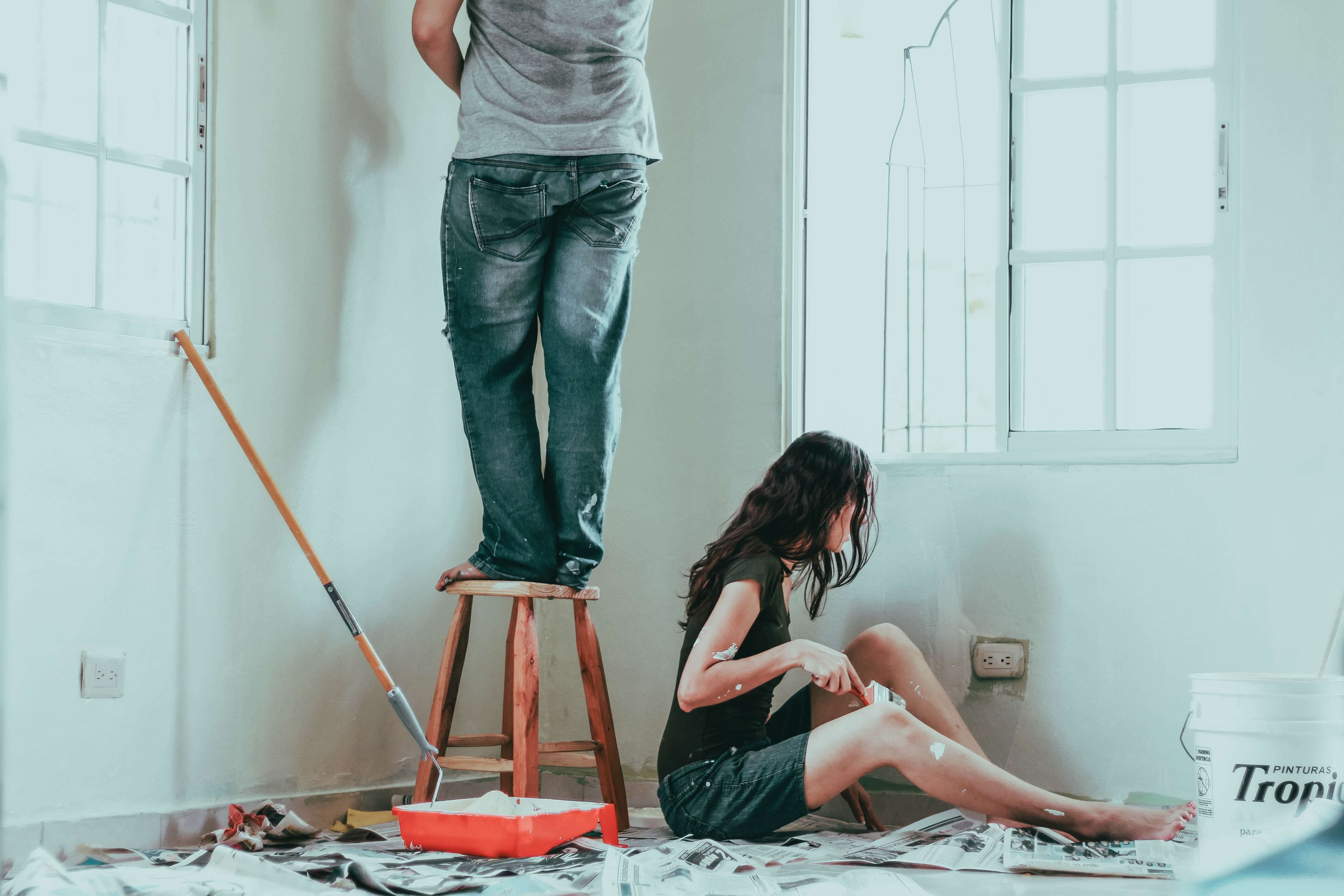 Couple painting their new apartment.