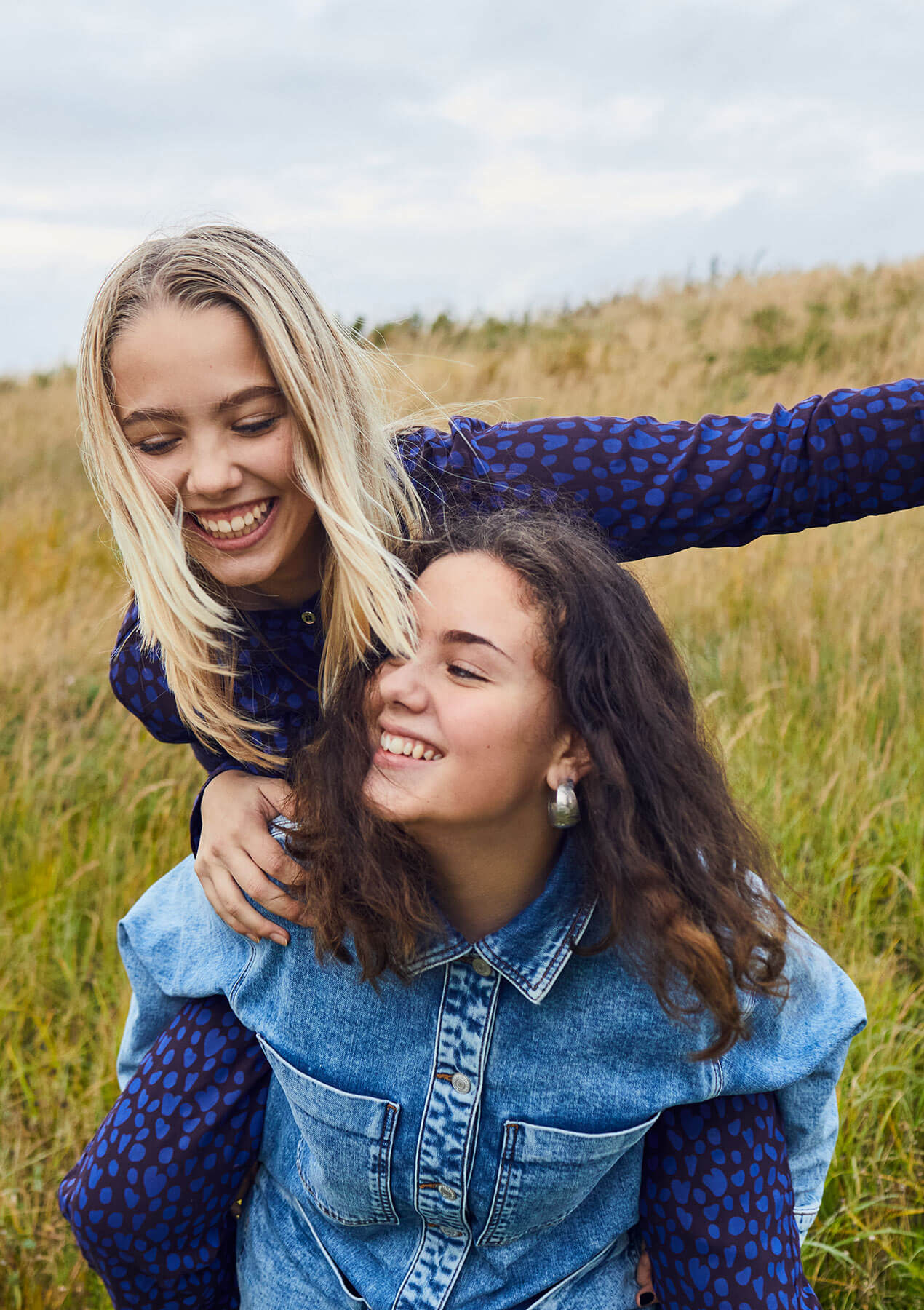 Two girls having fun in the nature.